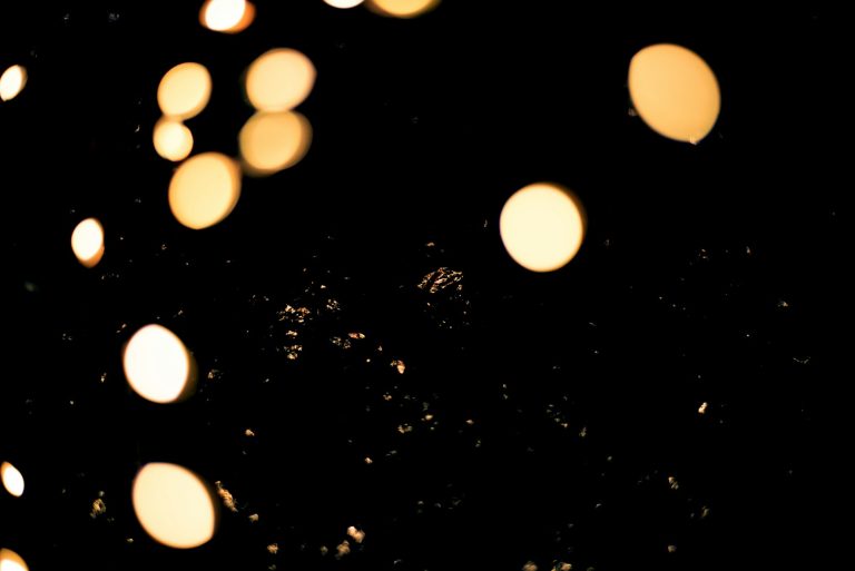 Isolated sparkles from lights on black bacground.